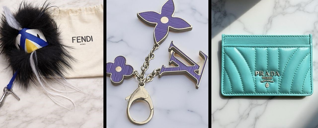 Fendi Black Hair Monster Bag Charm, Louis Vuitton Purple Monogram Bag Charm and Prada Turquoise Leather Card Holder